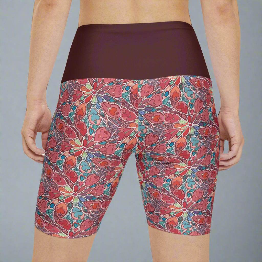 Floral workout shorts with vibrant patterns and quick-drying polyester for yoga and running.