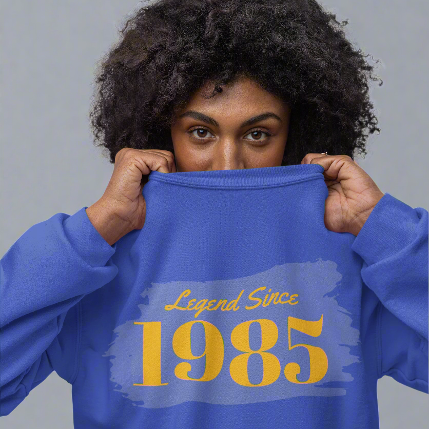 Year of Birth custom crewneck sweatshirt in blue with "Legend Since 1985" design.