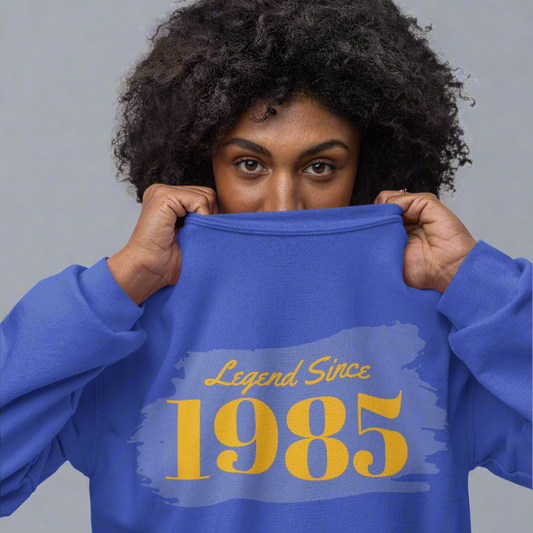 Year of Birth custom crewneck sweatshirt in blue with "Legend Since 1985" design.