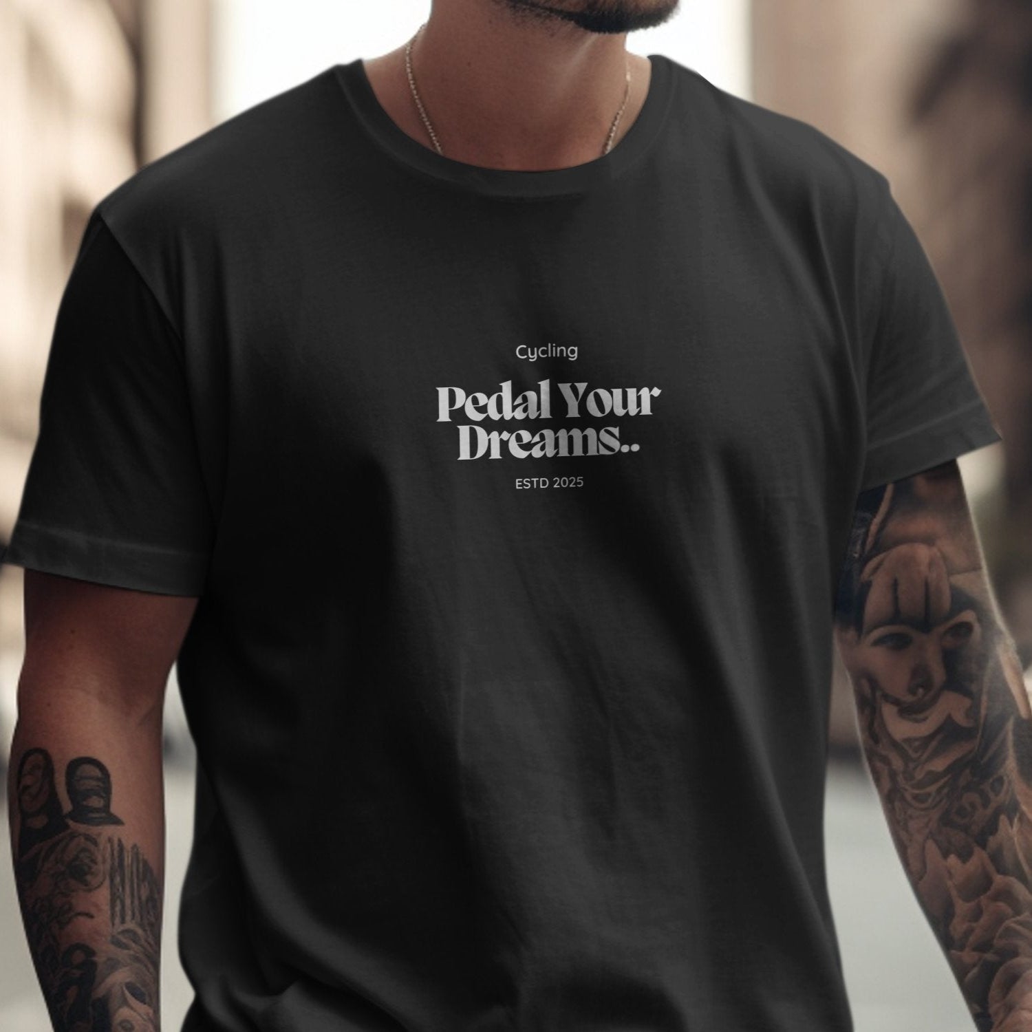 Cycling Pedal Your Dreams ESTD 2025 T-Shirt in black, featuring relaxed fit and unisex sizing for bike enthusiasts.