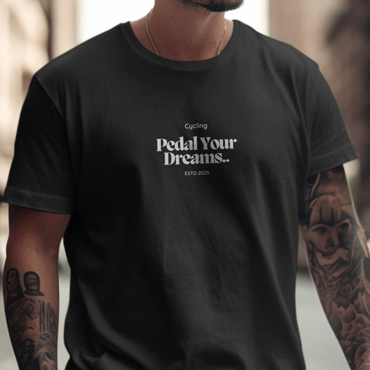 Cycling Pedal Your Dreams ESTD 2025 T-Shirt in black, featuring relaxed fit and unisex sizing for bike enthusiasts.