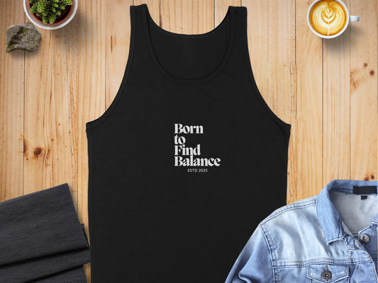 Born to Find Balance ESTD 2025 black graphic tank top on wooden surface