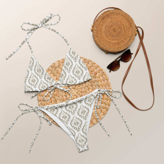 Boho Vintage Print String Bikini Set with elegant damask-inspired print, laid with accessories.
