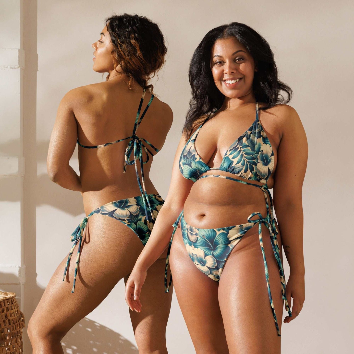 Elegant tropical blue floral string bikini set with gold accents, featuring adjustable halter ties, side-tie bottoms, and UPF 50+ sun protection.