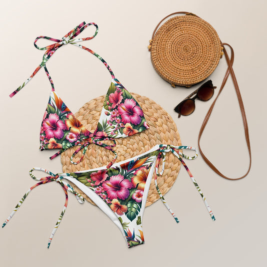 Vibrant tropical hibiscus string bikini set with bold floral print and adjustable ties, perfect for beach vacations.
