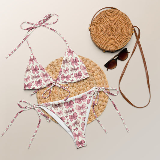 Butterfly pattern recycled string bikini with all-over print, featuring soft material and tie straps.