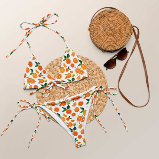 Citrus orange print string bikini set with adjustable ties and UPF 50+ sun protection.