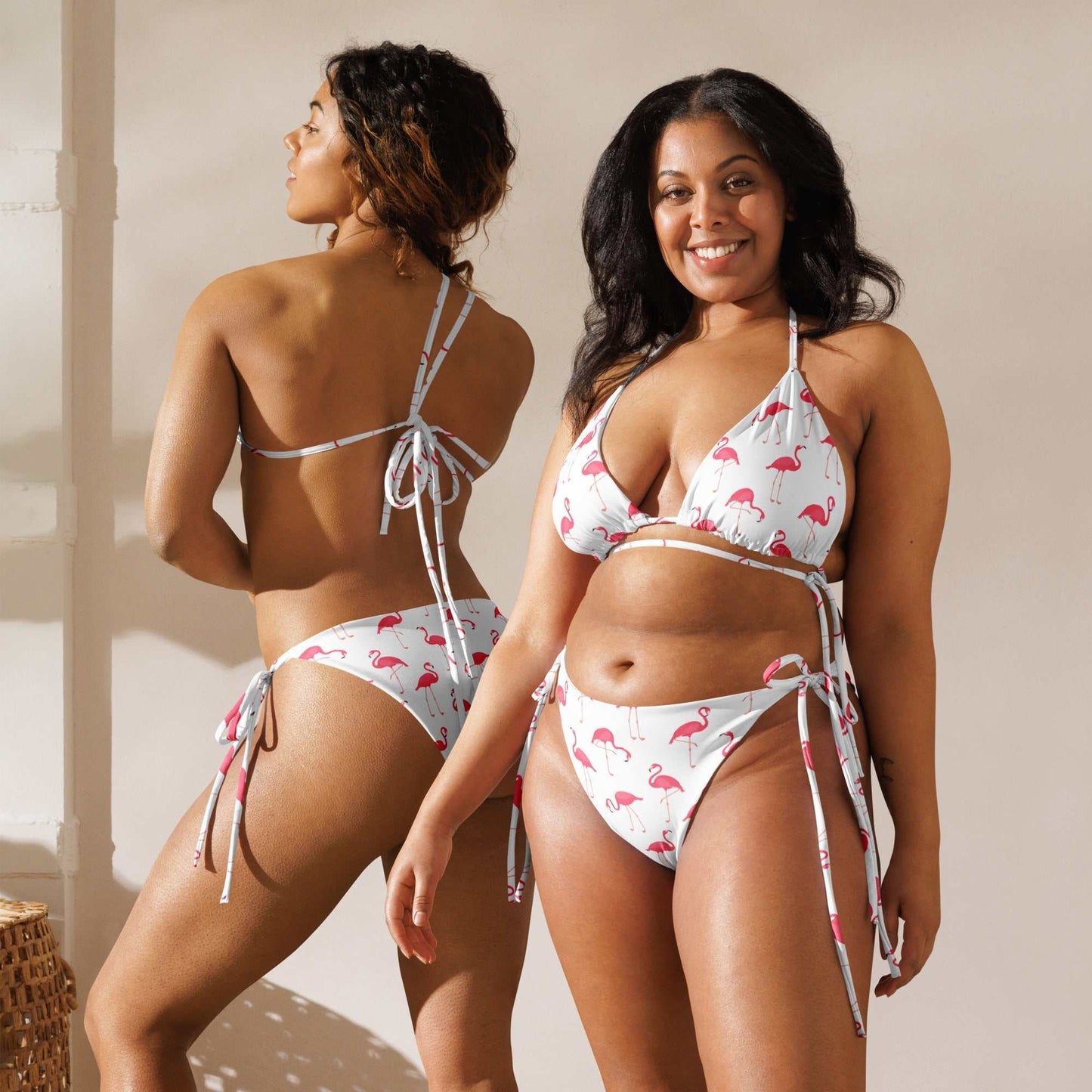 Flamingo Print Halter Bikini Set with UPF 50+, playful two-piece swimsuit featuring vibrant pink flamingo design on white background, adjustable halter neck and inclusive sizing.