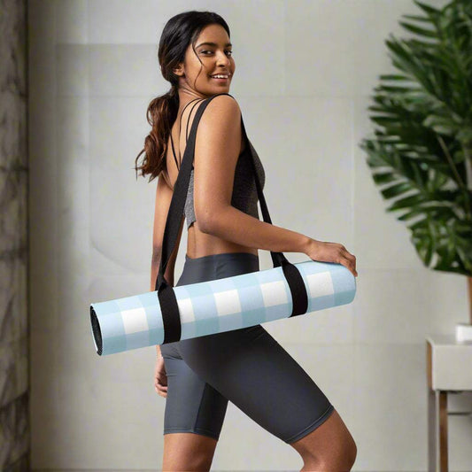 Checkered print yoga mat with anti-slip microsuede, carried by woman.