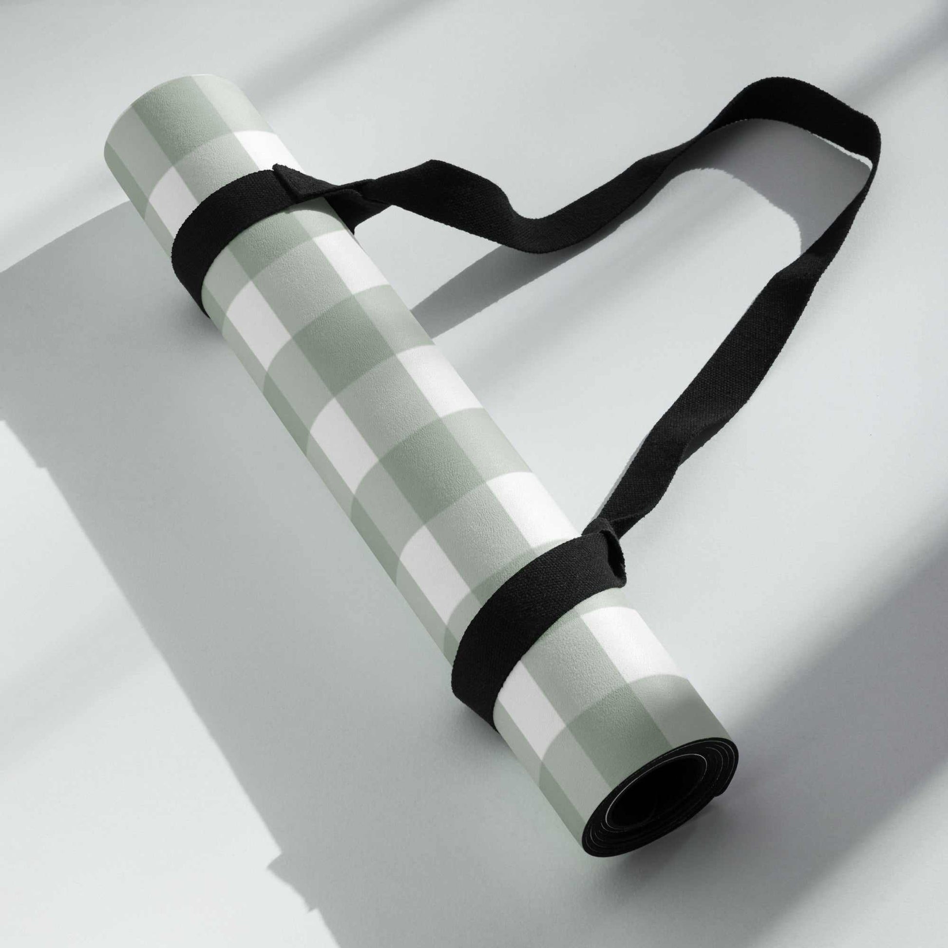 Yoga mat with green checkered pattern, anti-slip rubber bottom, and soft microsuede top, easy to carry.