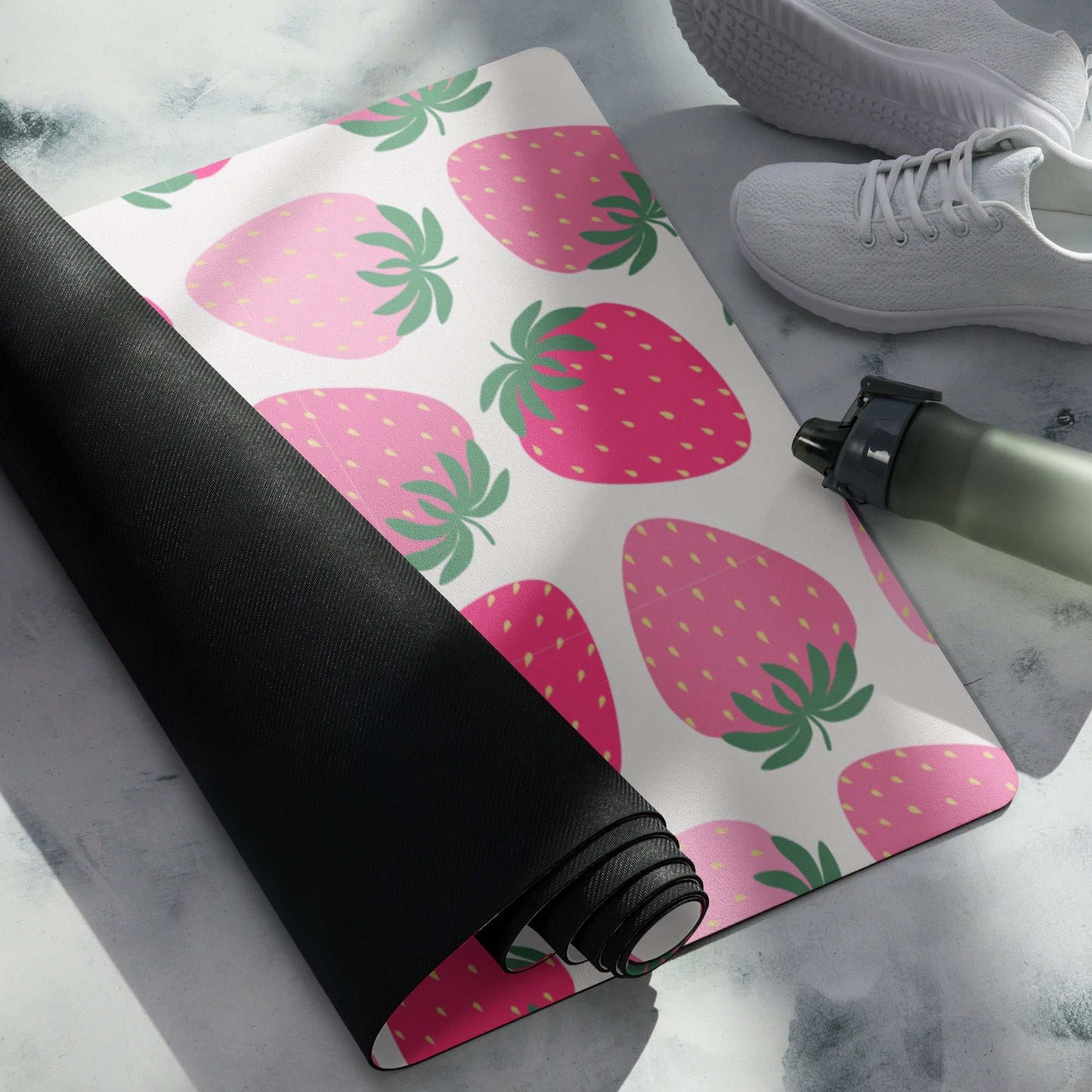 Strawberry-patterned yoga mat with anti-slip rubber bottom and microsuede top.
